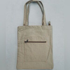 Plain cream/off white tote bag with front pocket
